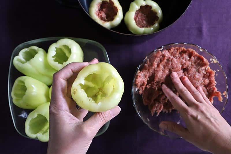 prepping peppers for stuffing